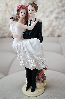 Bride and Groom Cake Topper Carry over Threshold Embrace Pink Roses Figurine- Le Petit Pain
